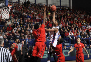 Courtesy of Athletic Department - Junior forward Darius Lewis shoots a fade away against the University of Dayton. 